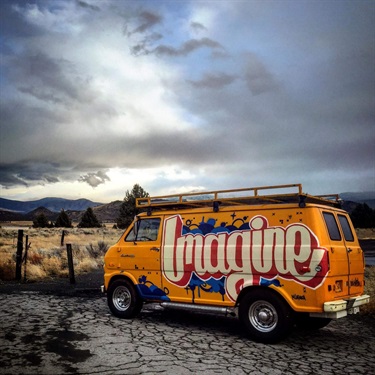 A mural with text on the side of a van. 