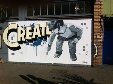 A mural with text on a wall. 