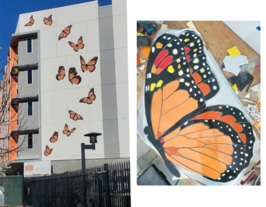 A colorful mosaic installation on the side of a building.