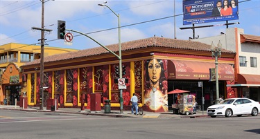 A colorful mural painted on the side of a building. 