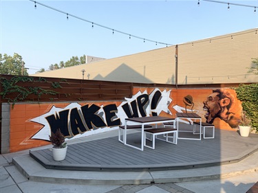 A mural painted on a fence. 