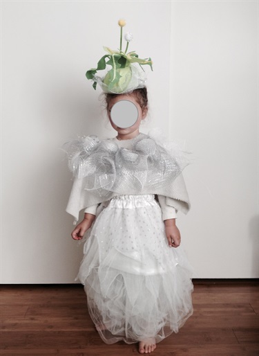 A child in a white dress.