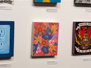 Artwork hanging on a wall. 