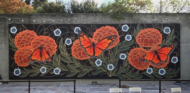 A mural painted on the side of a building. 