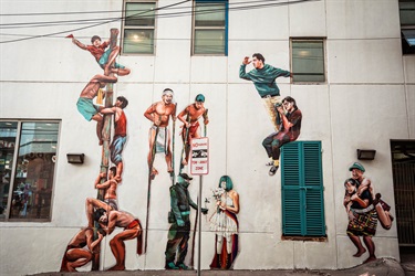 A mural painted on the side of a building. 