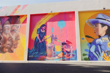 A mural painted on the side of a building. 