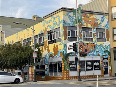 A mural painted on the side of a building. 