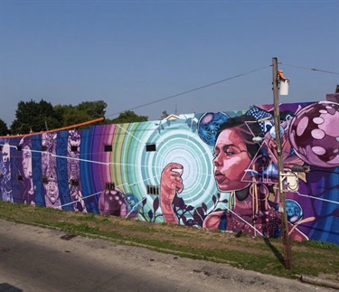 A mural painted along a wall. 