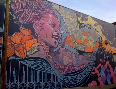 A mural painted on the side of a building. 