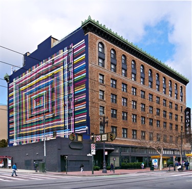 A mural painted on the side of a building. 