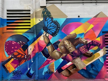 A mural painted on the side of a building. 