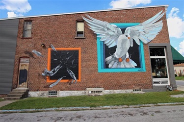 A mural painted on the side of a building. 
