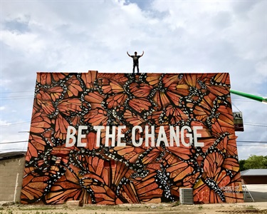 A mural painted on the side of a building. 