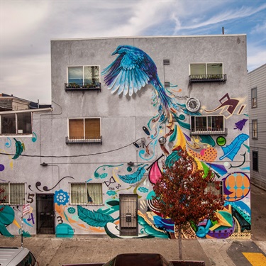 A mural painted on the side of a building. 