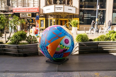 A  painted spherical sculpture.