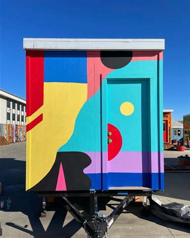 A mural painted on the side of a building. 