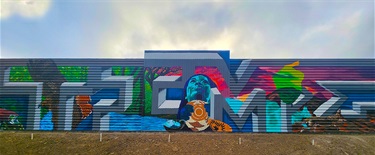 A mural painted on the side of a building. 