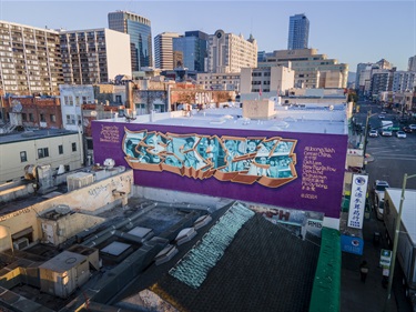 A mural painted on the side of a building. 