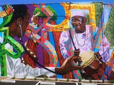 A mural painted on the side of a building. 