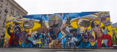 A mural painted on the side of a building. 