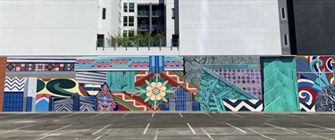 A mural painted on the side of a building. 