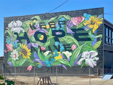 A mural painted on the side of a building. 