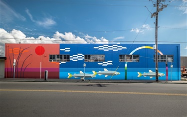 A mural painted on the side of a building. 