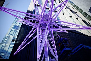 A purple outdoor sculpture.