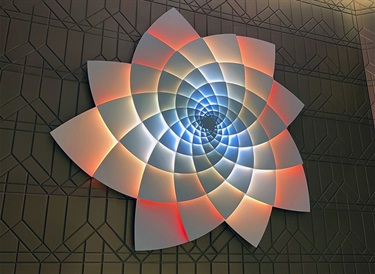 An illuminated abstract sculpture.