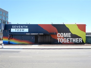 A mural painted on the side of a building. 