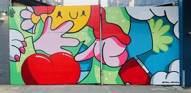 A mural painted on the side of a building. 