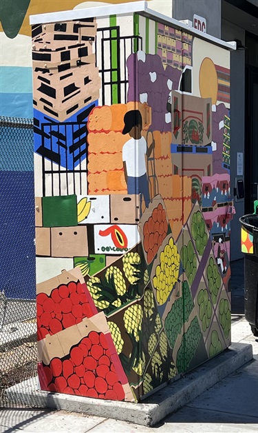 A utility box painted with artwork. 