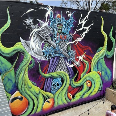 A mural painted on the side of a building. 