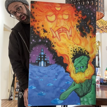 A person holding a piece of abstract art. 