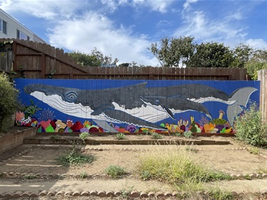 A mural painted on a fence.