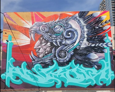 A mural painted on the side of a building. 