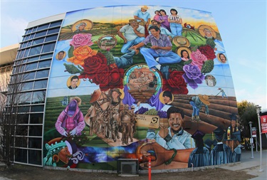A mural painted on the side of a building. 