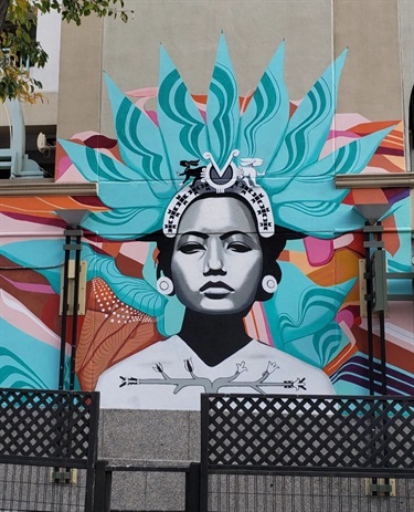 A mural painted on the side of a building. 