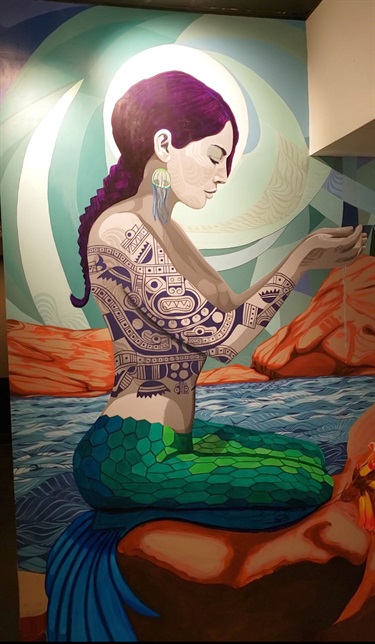 A mural painted on a wall inside a room. 