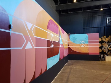 A mural painted on a wall inside a room. 