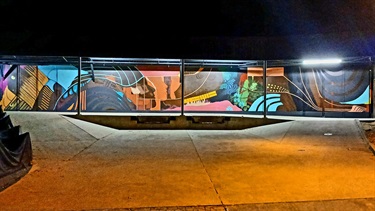 A mural painted on the side of a building. 