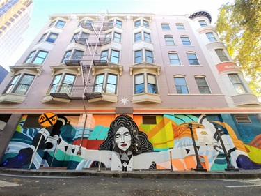 A mural painted on the side of a building. 