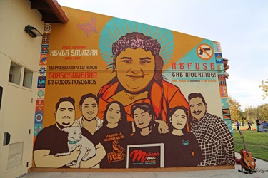 A mural painted on the side of a building. 