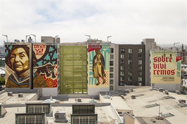 A series of murals painted on the side of a building. 