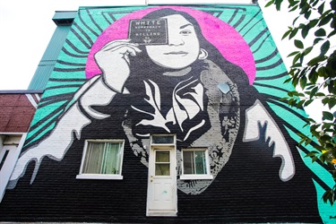 A mural painted on the side of a building. 