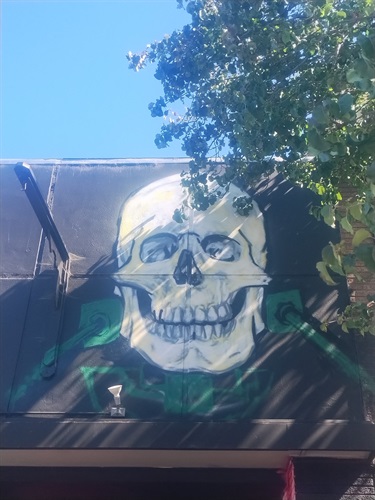 A mural painted on the outside of a building. 