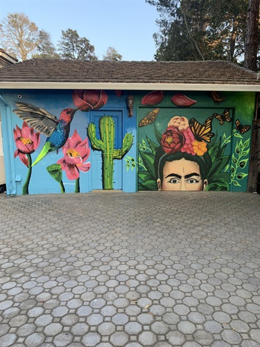 A mural painted on the side of a building. 