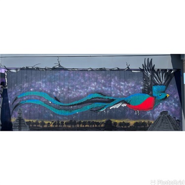 A mural painted on the side of a building. 