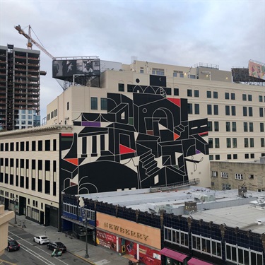 A mural painted on the side of a building. 