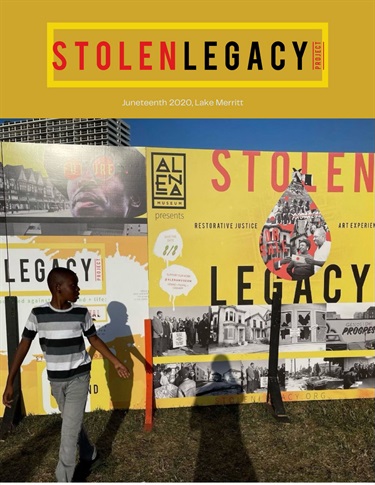 A photo of a person in front of a wall. 